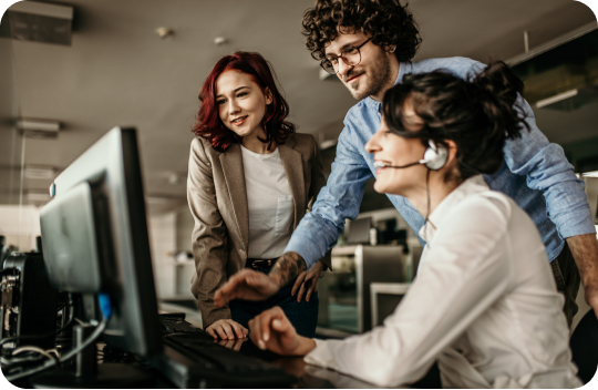 Office colleagues working together at a computer
